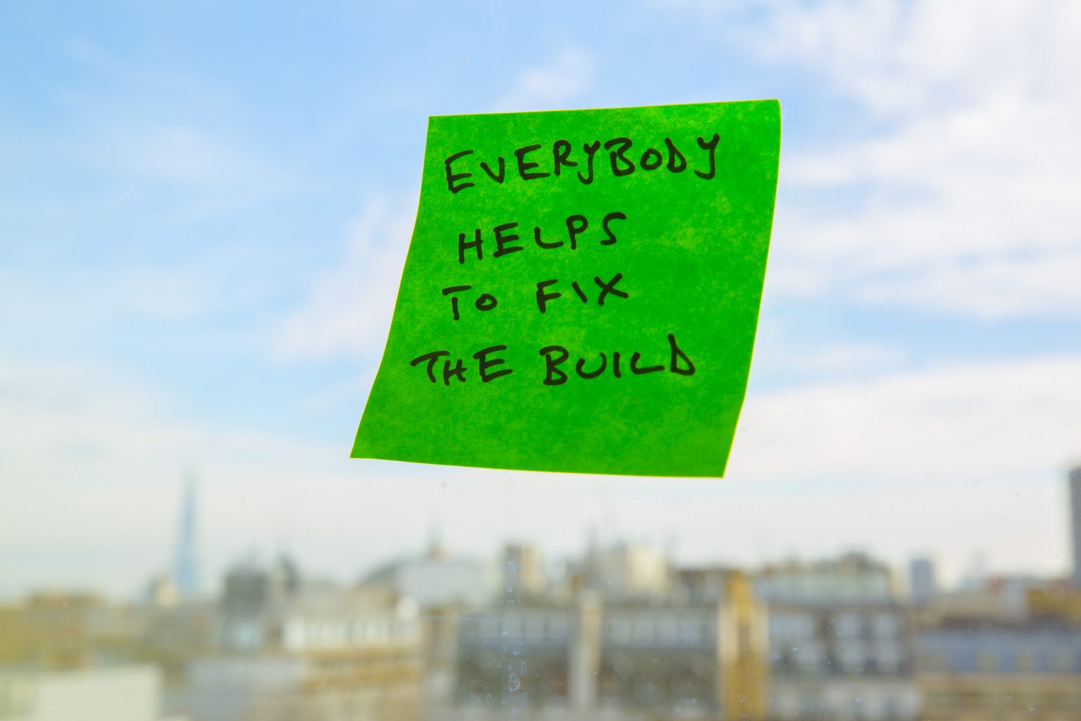 Post-it note: Everyone helps to fix the build