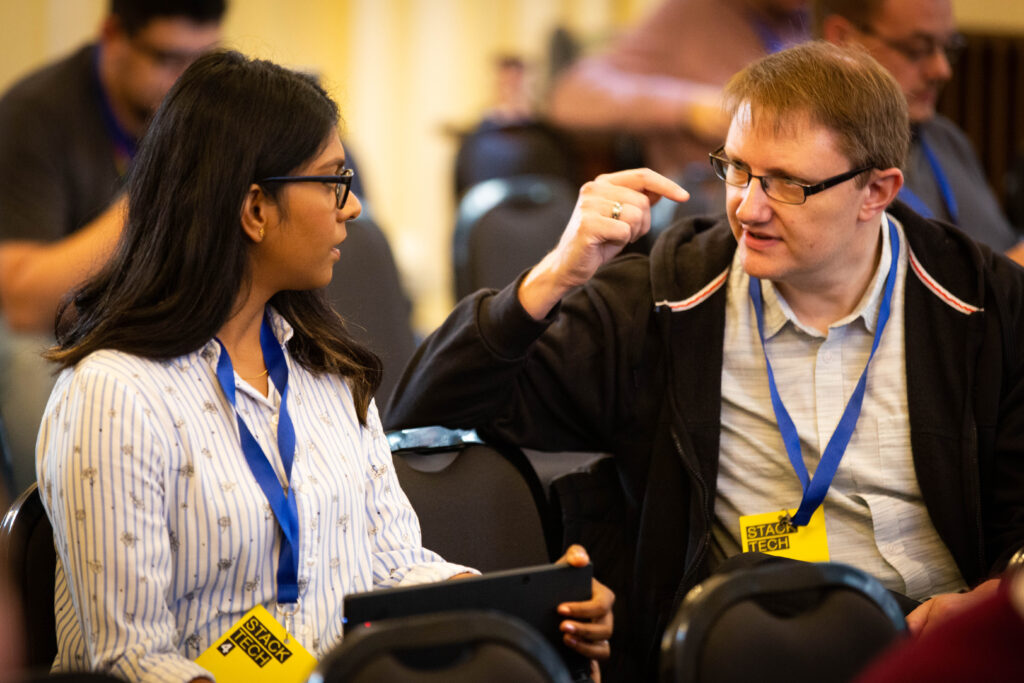 Two attendees talking