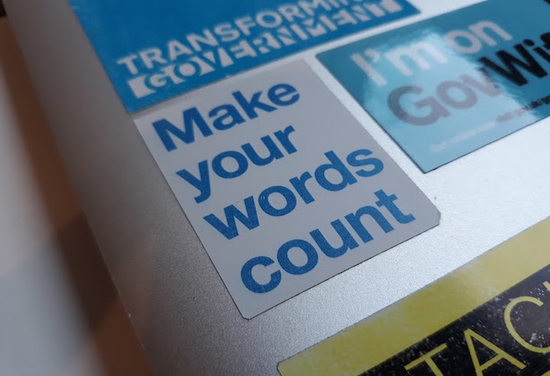 A laptop with a sticker saying make your words count