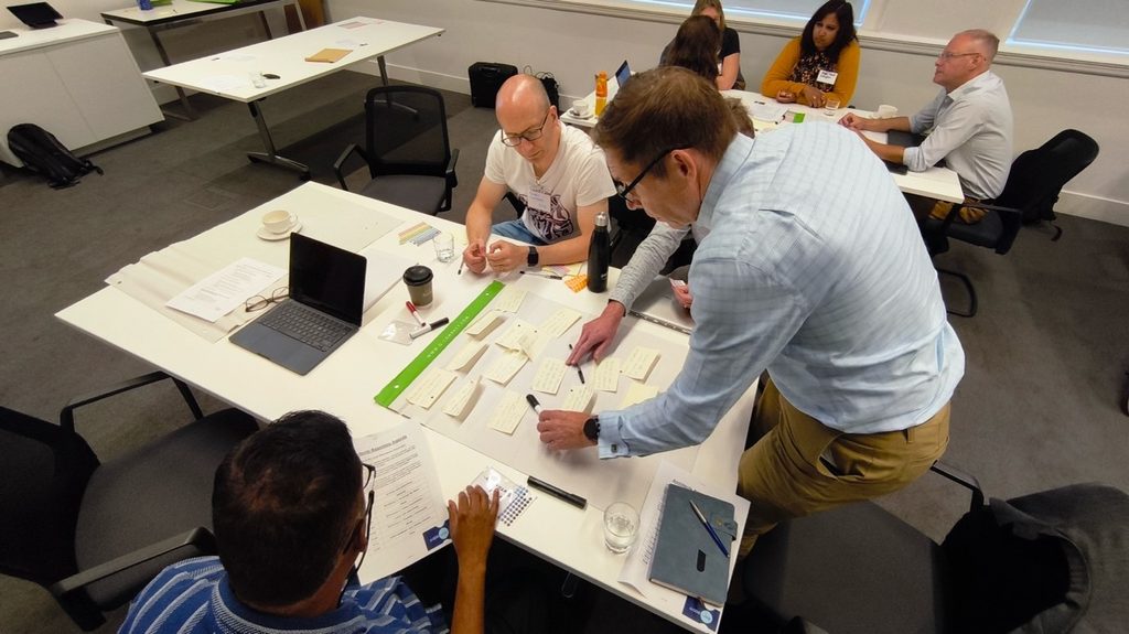 A group of Technical Architects taking part in a brainstorming workshop together.