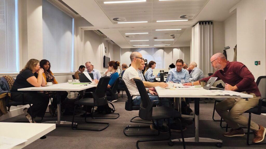 A group of Technical Architects working together in a room